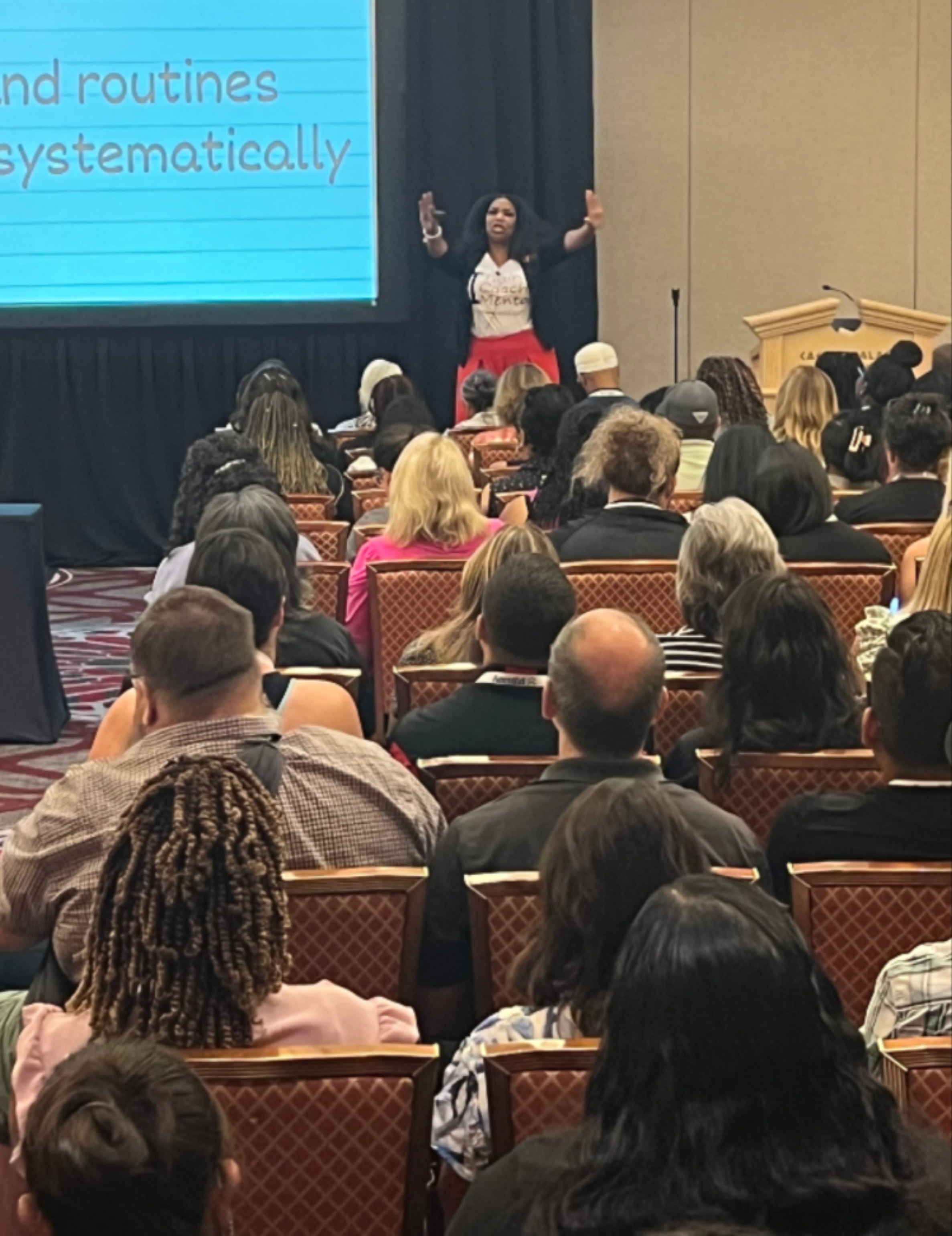 Dr. Z speaking on stage